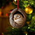 Christmas tree ornament featuring a cute owl sleeping in a hollow tree with red ribbon - Sleeping Owl