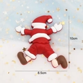 Detail of soft glue Santa Claus cake topper decoration with dimensions 10cm by 8.5cm - Soft Glue Lying Santa Claus