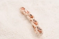 Macro shot of rose gold spring hair clip with peach marquise crystals and rhinestones - Peach