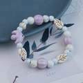 Handmade ceramic bracelet with bird and leaf charms in white, beige and lavender - Lilac Bird Style (1492-02)