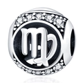 Macro view of silver Virgo zodiac charm with sparkling cubic zirconia stones and cutout - Virgo