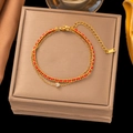 Double-layered 18K gold plated titanium bracelet with red cord and zircon stone - Gold Zirconia Red String Bracelet (SLE2115)