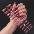 Macro view of long ballerina-shaped press-on nails with glossy UV finish in mauve pink - Smoky Pink (ZBLL-11)