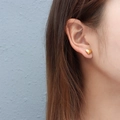 Elegant 18k gold plated heart stud earrings shown on ear for a minimalist look - One Pair / Gold