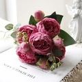 Top view of deep pink artificial peonies with layered petals on lace cloth - Rose Red