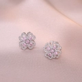 Macro shot of clover-shaped stud earrings with pink gemstone and white cubic zirconia - Steel Color Pink Rotating Earrings (E0886)