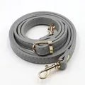 Detail of grey PU leather bag strap with golden metal buckle and white stitching - Grey (Gold Clasp)