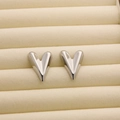 Polished silver heart-shaped stainless steel stud earrings in a beige velvet jewelry box - R195 3D Heart / Steel