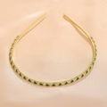 Close-up of golden headband with emerald and white zircon gemstones on silk - Green White Gold (FG0009-5)
