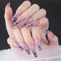 Detailed view of long almond press-on nails with nude base and blue flame patterns - CBLCY-K11 Nude Pink Blue Flame