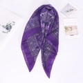 Detail of purple paisley print silk scarf displayed with Kinfolk magazine backdrop - 70*70cm / Violet