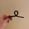 Glossy black metallic hair claw clip with twisted design and gold spring detail - Large 11.5cm / Black