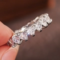 Macro shot of silver heart-shaped cubic zirconia ring with classic claw setting - US 6 / Heart Cut