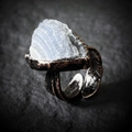 Macro detail of vintage bronze feather ring featuring a natural triangle agate stone - Solar Agate Druzy (Random Shape)