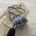 Ethnic style bucket bag with blue geometric canvas pattern and light blue leather base - Blue White Geometric