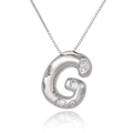 Macro shot of silver letter G pendant with white zircon stones and classic box chain - Letter G