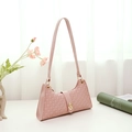 Pink baguette underarm bag with circular embossed texture and golden twist lock clasp - Pink
