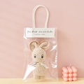 Light brown coral fleece towel folded into a cute rabbit shape in gift bag - Khaki + OPP Handbag