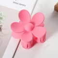 Close-up of a pink matte flower hair claw clip on a minimalist white aesthetic background - 7cm / Pink