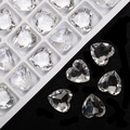Sparkling 12mm clear heart-shaped crystal glass rhinestones on a black background - Clear White
