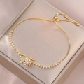 Macro shot of gold adjustable rabbit charm bracelet with sparkling zircon stones - Gold Bunny and Floral Style (TS0187)