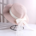 Pink woven straw sun hat for women featuring a delicate white lace bow detail - Lace Bow Straw Hat Pink