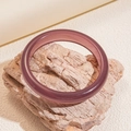 Macro shot of minimalist translucent purple resin bangle on natural stone base - Bracelet-Purple
