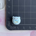 Close-up of a 1.2cm blue resin bear miniature on a ruler for DIY hair accessories - Blue Open Bread