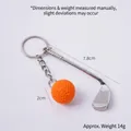 Mini metal golf club keychain with orange golf ball accessory and size measurements - Orange Golf Ball + Club
