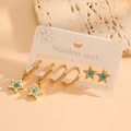 Detailed set of gold stainless steel star earrings with blue evil eye charms on beige card - Star Evil Eye Earring Set (G315)