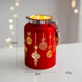 Detail of red Christmas lantern with gold ball patterns and rustic hemp rope handle - Glowing Lantern - Red