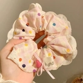Roze kant haarelastiekje met stippen, strik en hartdetail op een Handi-label - #1 Romantisch Roze