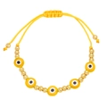 Detail of bohemian yellow cord bracelet with evil eye beads and adjustable golden closure - Yellow