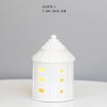 Close-up of white ceramic LED house lamp with 7.5x7.5x10.5cm dimensions and warm light - RH2279 (7.5x7.5x10.5cm)