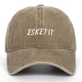 Detail shot of white ESKETIT letter embroidery on a washed khaki vintage baseball cap - Khaki
