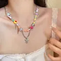 Detail van een dubbellaagse kralenketting met kleurrijke bedeltjes en een zilveren kruis - Stijl 2# Dubbellaagse Kruis Konijn Kralenketting