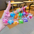 Lot de six porte-clés étoiles à paillettes liquides colorées avec grelots décoratifs - Style Fermoir Mousqueton / Style pentagramme flash multicolore (Mélange aléatoire)