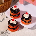 Macro view of miniature chocolate cake charms on a tray with dimension measurements - Cherry Mille-Feuille Tart