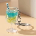 Detailed view of mini glowing goblet keychain with blue drink, lemon slice, and straw - Blue