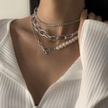 Layered silver chain necklace with white pearls and OT toggle clasp on model - Style 05 Silver