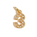 Detailed close-up of a gold number 3 pendant with sparkling cubic zirconia crystals - Number 3 / Gold