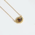 Gold Devil's Eye pendant necklace with orange fire pattern and sparkling crystals - Orange