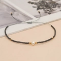 Bohemian handmade bracelet with dark grey matte beads and a central white natural pearl - Dark Gray