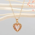 Elegante goldene Herz-Halskette mit champagnerfarbenem Kristall und Zirkonia-Akzenten - Rosa