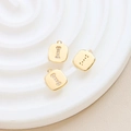 Macro shot of gold-plated square letter I pendant with inlaid cubic zirconia details - Letter I