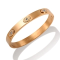 Polished gold stainless steel bangle featuring blue rhinestone evil eye designs - MSXBFF113R