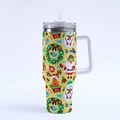 Detail of 40oz yellow Christmas tumbler with Santa, reindeer and snowman festive prints - Style 6