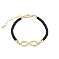 Detailed view of infinity charm with clear crystals on black braided rope bracelet - Infinity / Black