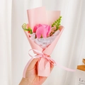 Close-up of a single pink soap rose bouquet with a Just For You ribbon on white background - Pink