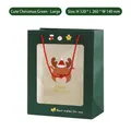 Large dark green Christmas gift bag with reindeer window and red woven handles - Large / Green